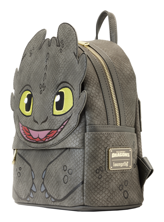 Backpack with dragon design featuring yellow eyes and a smiling mouth on a white background