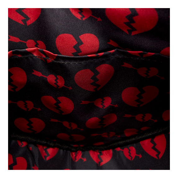 Black fabric with red broken heart pattern